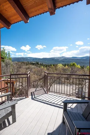 a view of a balcony with wooden floor