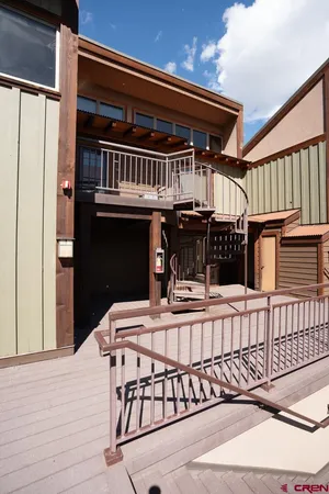 a view of a balcony with furniture