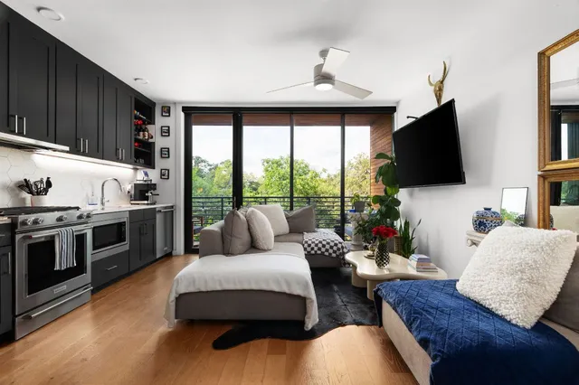 a living room with furniture fireplace and flat screen tv