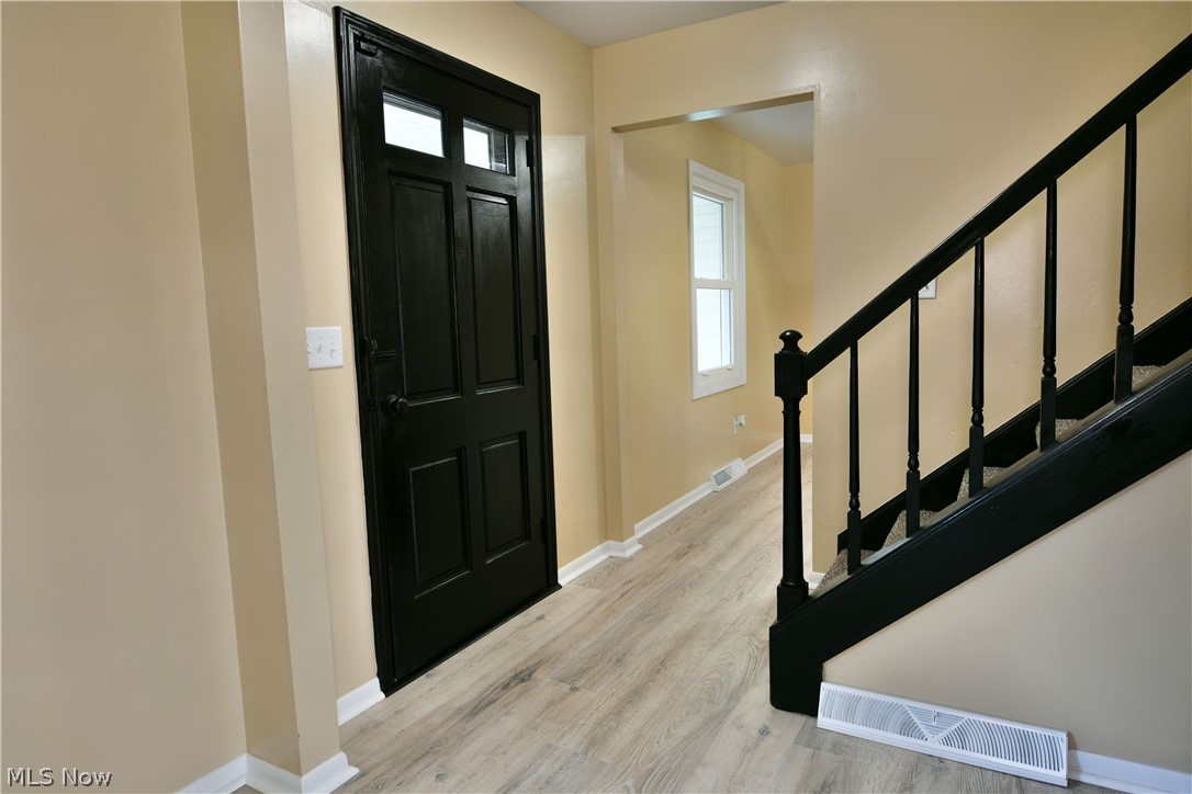 105 Fairview Avenue Cortland, OH 44410 - Photo 7 of 47 Entrance foyer with stairs and light wood finished floors