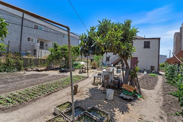 a view of a backyard with sitting area