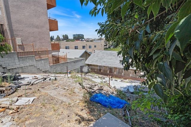 a view of a terrace with a table and chairs