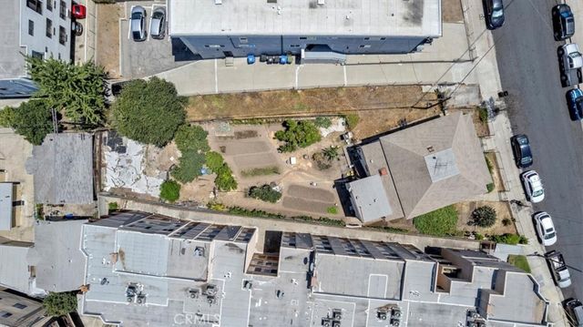 a buildings covered with tall trees