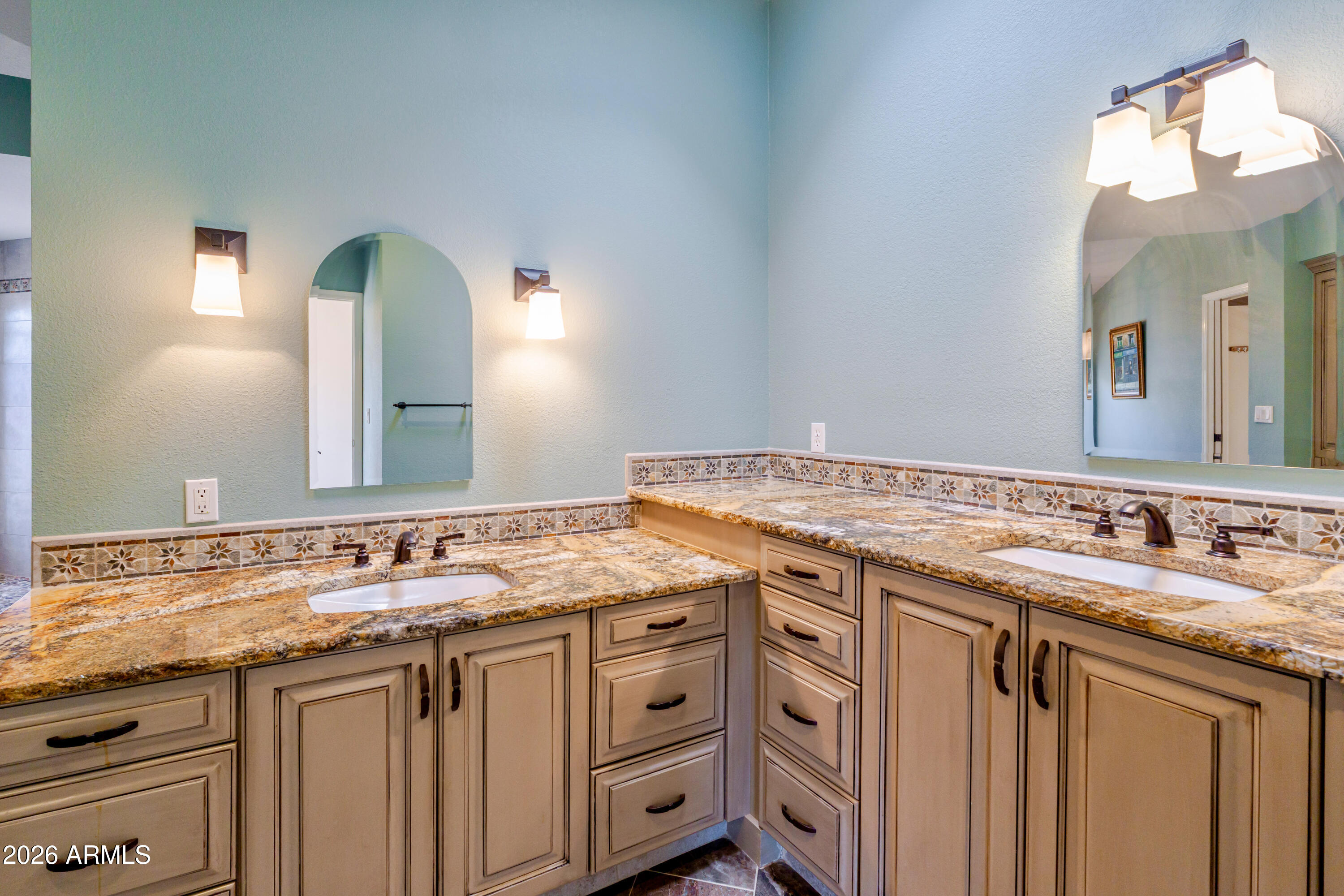19125 East Vía Esquina Rio Verde, AZ 85263 - Photo 29 of 50 a bathroom with a granite countertop sink and a mirror