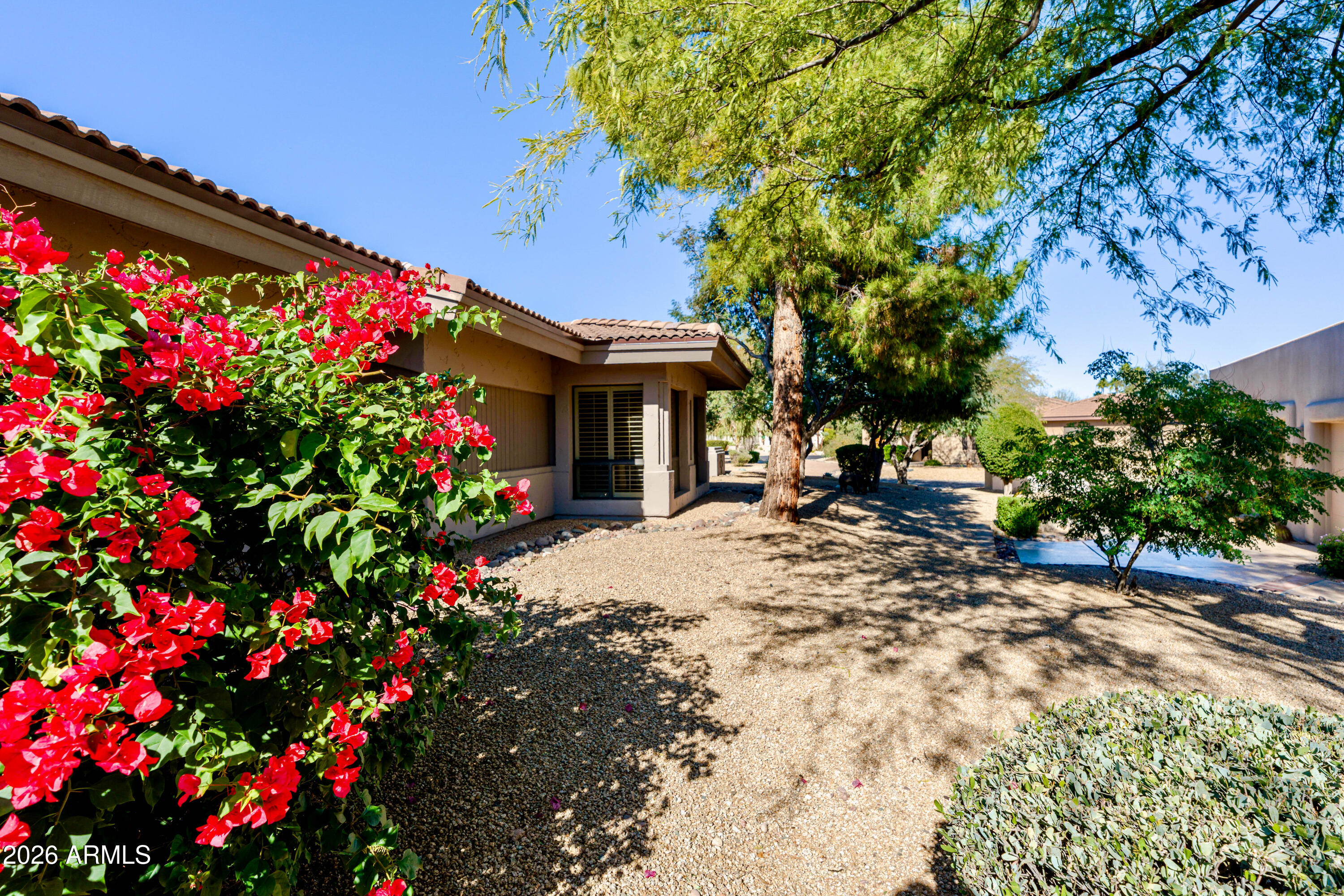 19125 East Vía Esquina Rio Verde, AZ 85263 - Photo 33 of 50 a view of a house with a flower garden