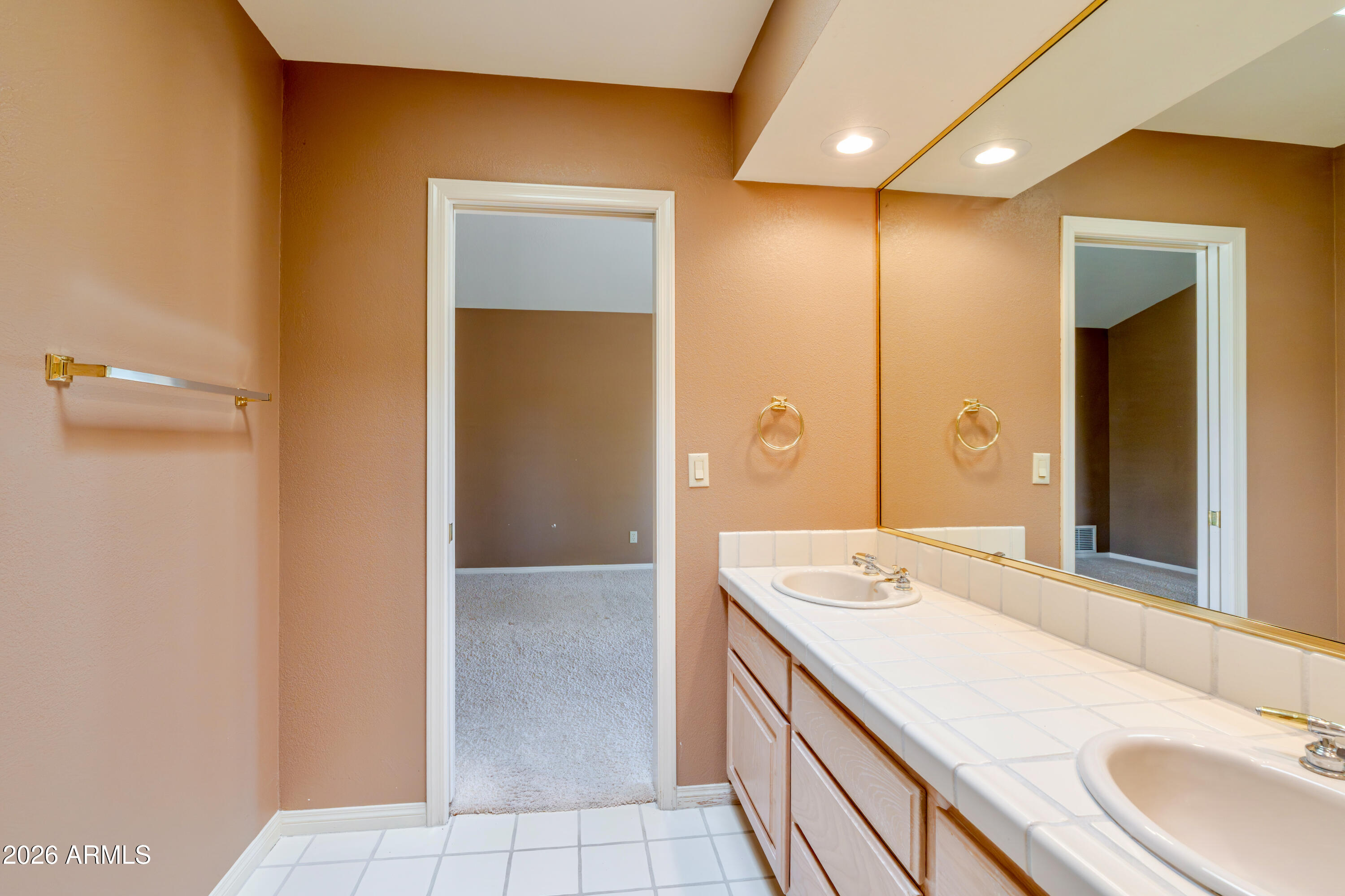 19125 East Vía Esquina Rio Verde, AZ 85263 - Photo 37 of 50 a bathroom with a granite countertop sink and a mirror