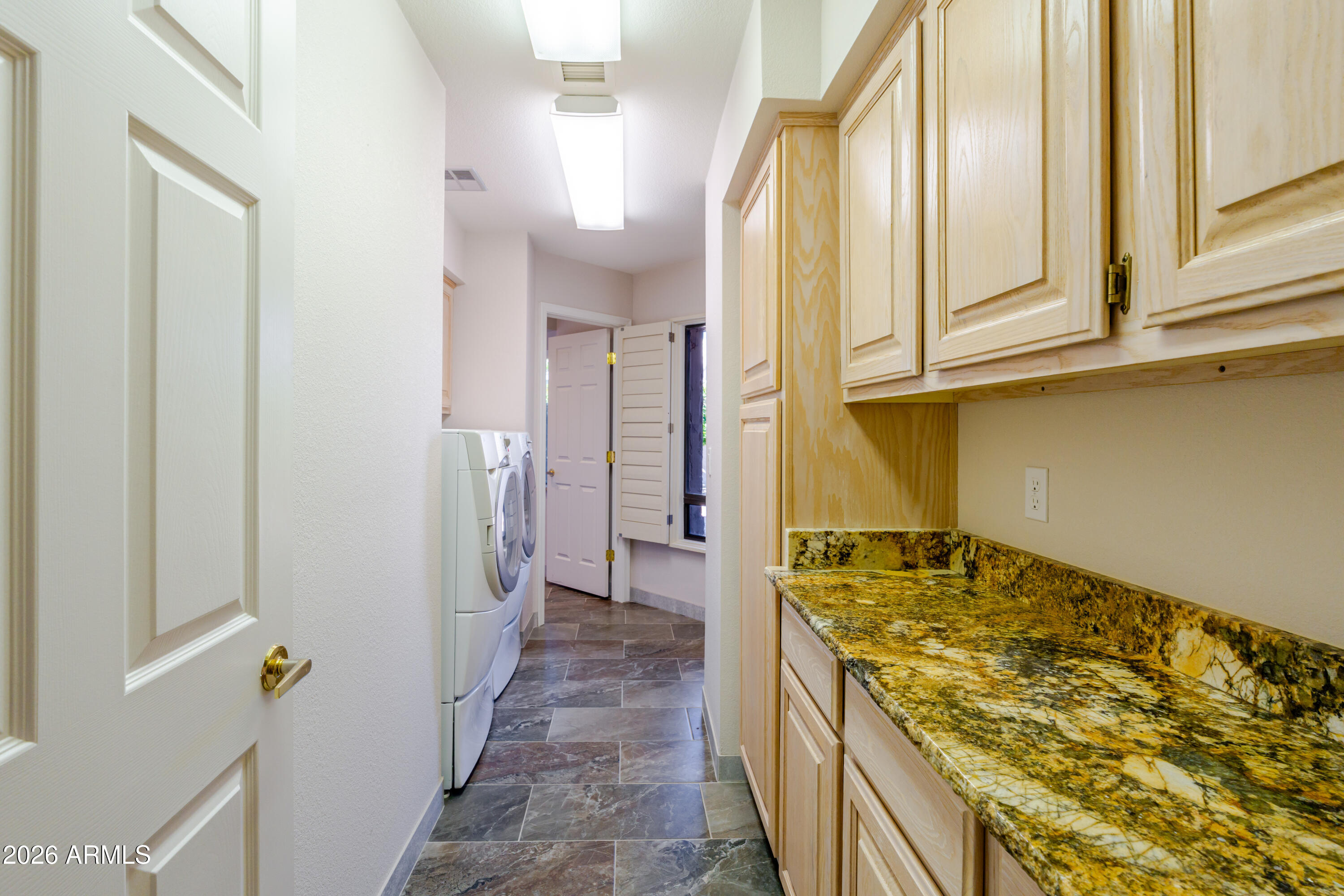 19125 East Vía Esquina Rio Verde, AZ 85263 - Photo 43 of 50 a bathroom with a granite countertop sink and a mirror