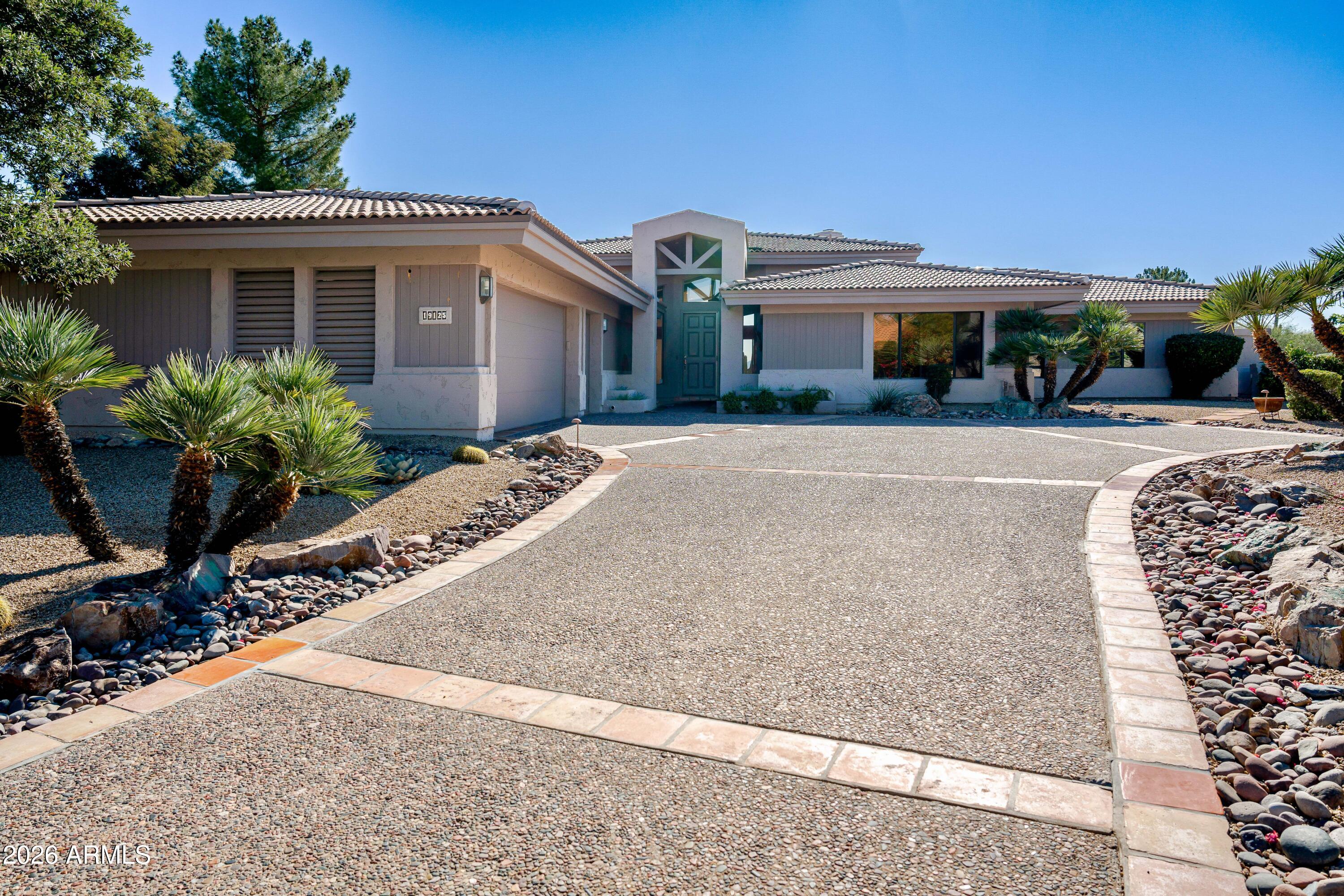 19125 East Vía Esquina Rio Verde, AZ 85263 - Photo 48 of 50 a front view of a house with a garden