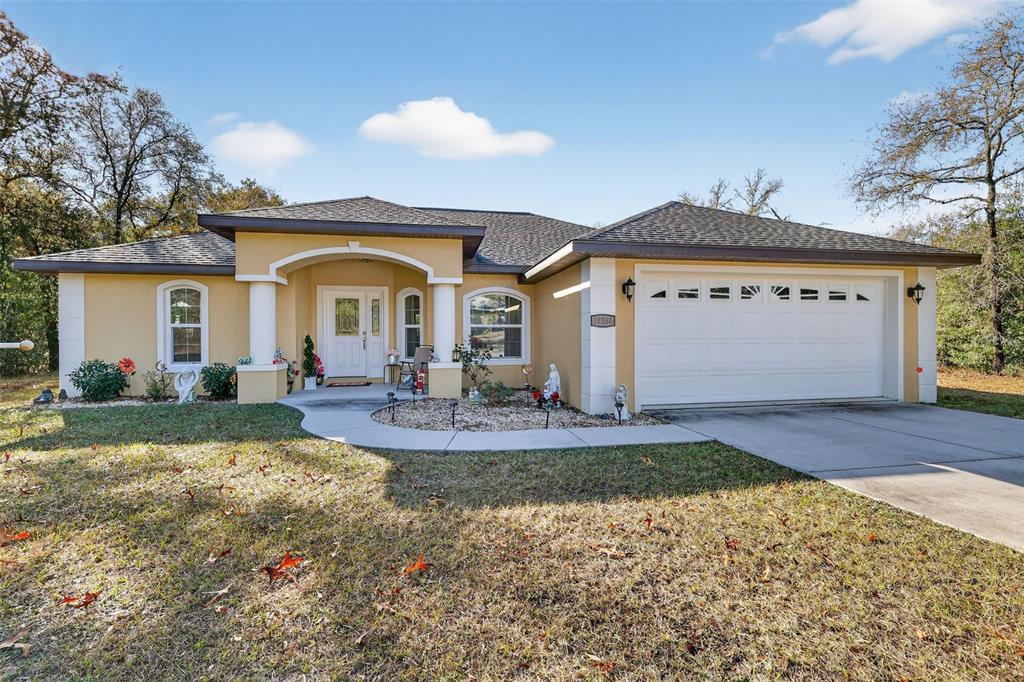18168 Southwest 65th Loop Dunnellon, FL 34432 - Photo 1 of 26 a view of a house with a patio