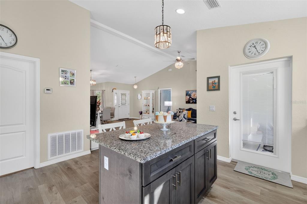 18168 Southwest 65th Loop Dunnellon, FL 34432 - Photo 12 of 26 a open kitchen with a table and chairs
