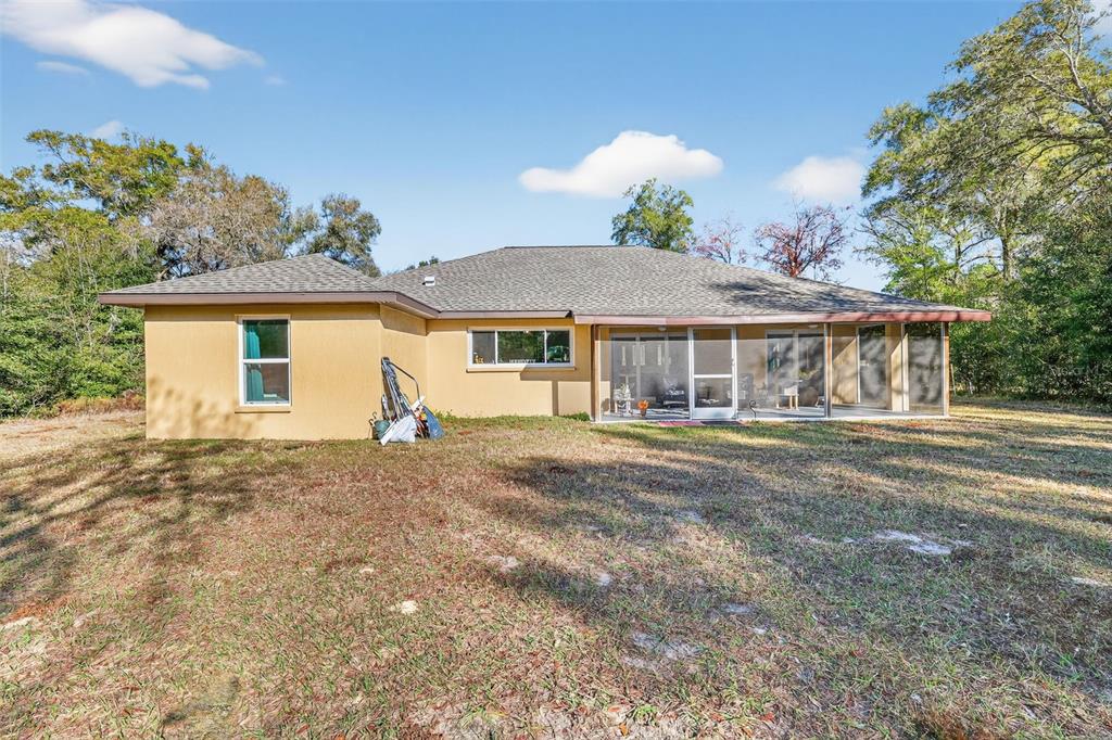 18168 Southwest 65th Loop Dunnellon, FL 34432 - Photo 24 of 26 a front view of a house with a garden