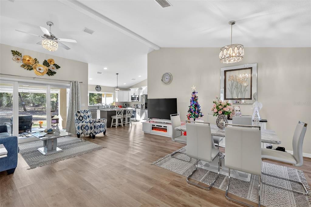 18168 Southwest 65th Loop Dunnellon, FL 34432 - Photo 4 of 26 a living room with furniture and a flat screen tv