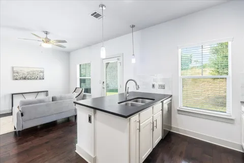 a view of a lake with houses in the back