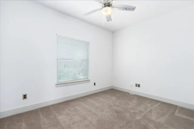 a bathroom with a shower and a toilet