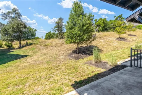 a view of yard with swimming pool
