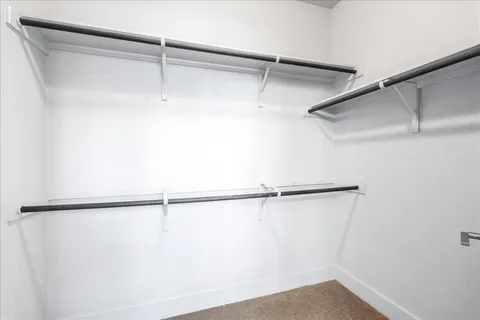 a bathroom with a sink and mirror with toilet