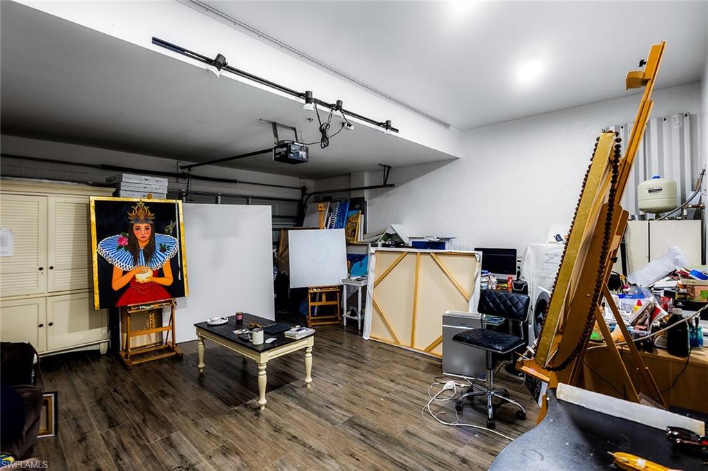 1064 Hampton Circle Naples, FL 34105 - Photo 25 of 32 a view of a room with gym equipment