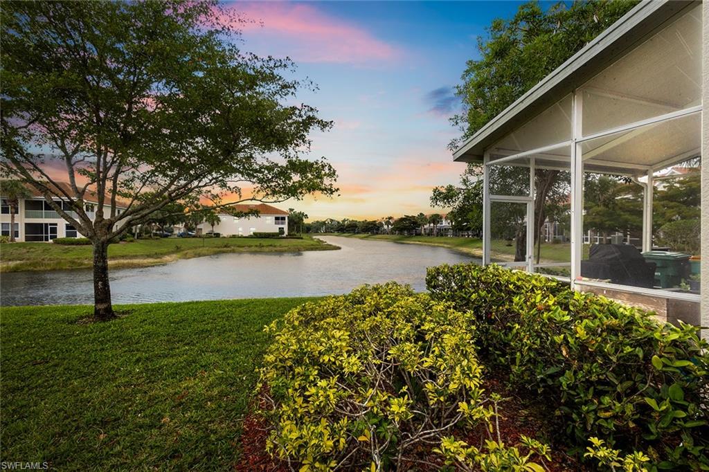 1064 Hampton Circle Naples, FL 34105 - Photo 29 of 32 a view of a lake with a garden and trees