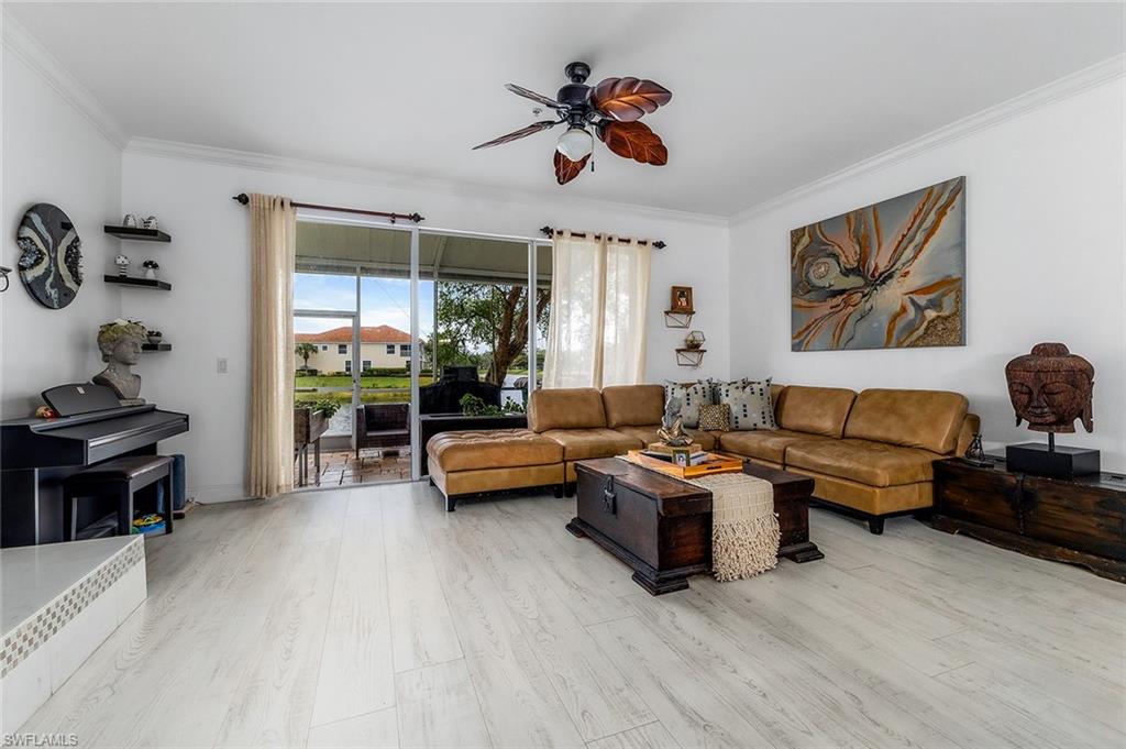 1064 Hampton Circle Naples, FL 34105 - Photo 5 of 32 a living room with furniture and a large window