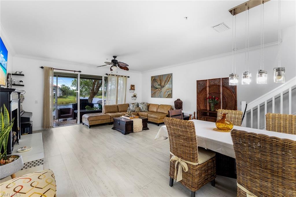 1064 Hampton Circle Naples, FL 34105 - Photo 7 of 32 a living room with furniture and a flat screen tv