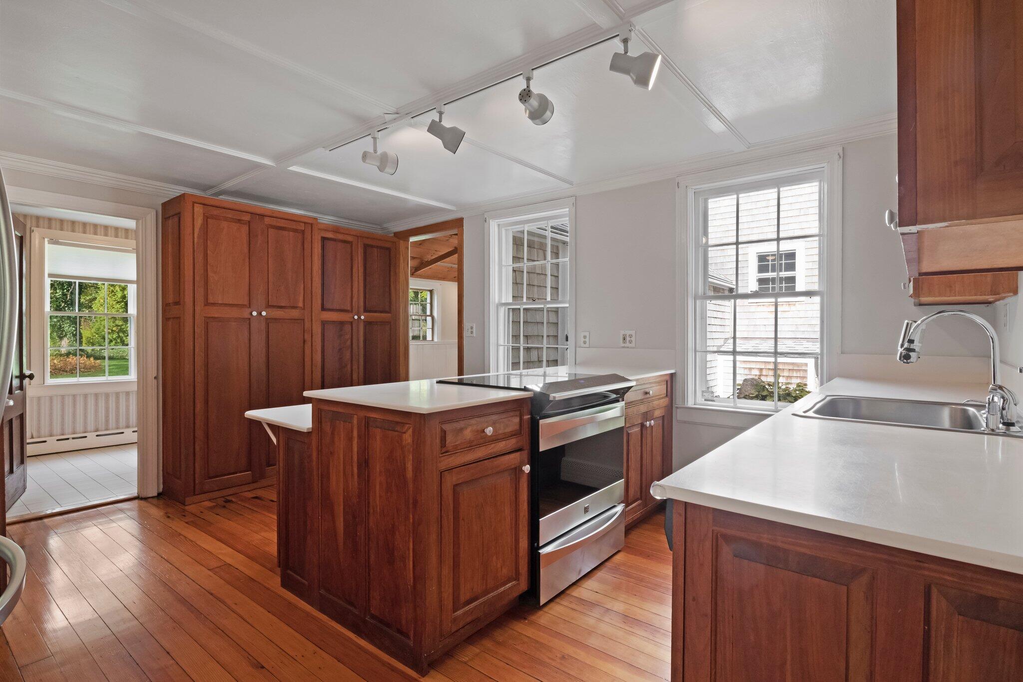 99 Main Street Sandwich, MA 02563 - Photo 16 of 43 a kitchen with stainless steel appliances granite countertop a stove and a sink