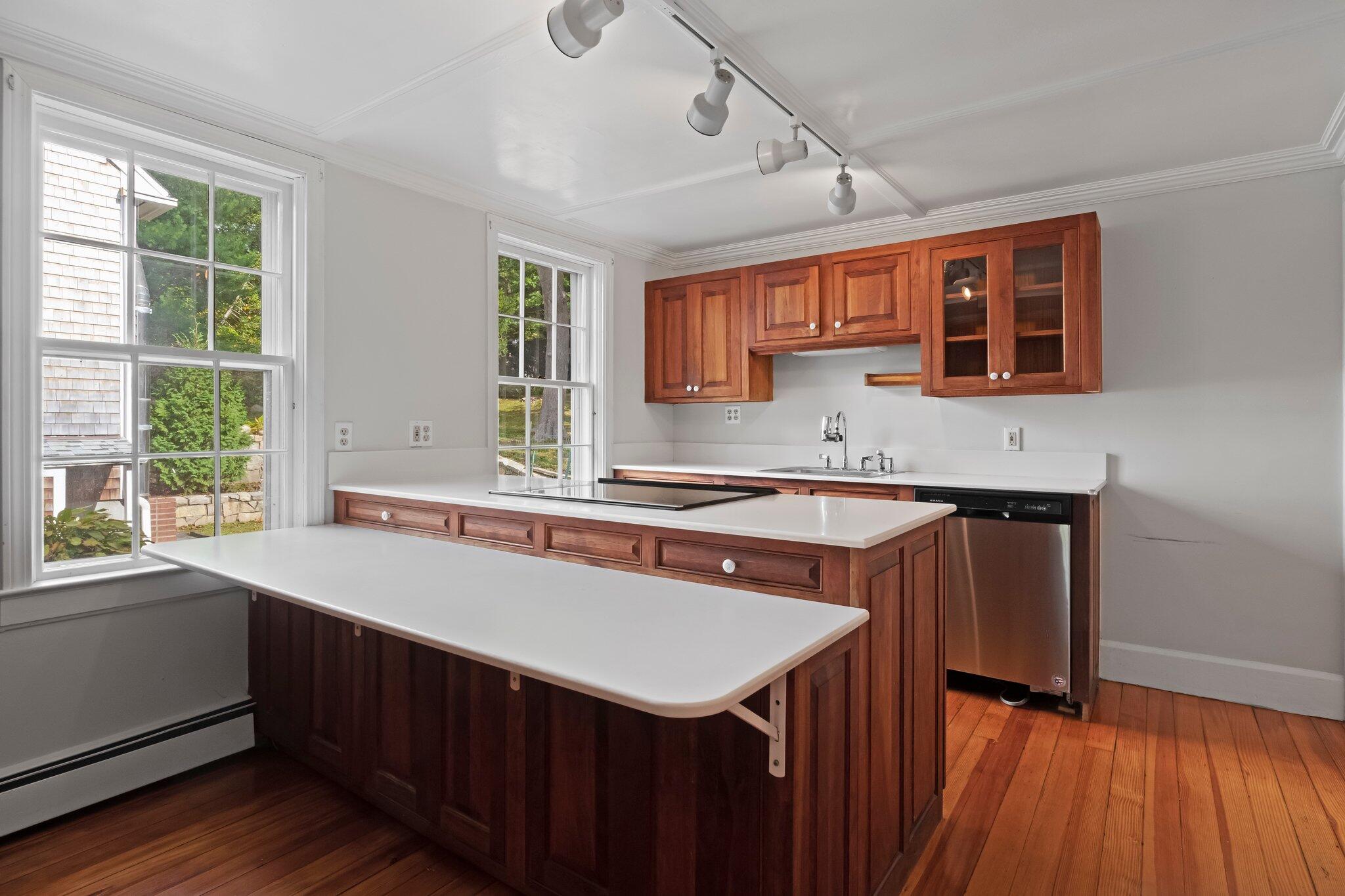 99 Main Street Sandwich, MA 02563 - Photo 17 of 43 a kitchen with a sink a window and appliances