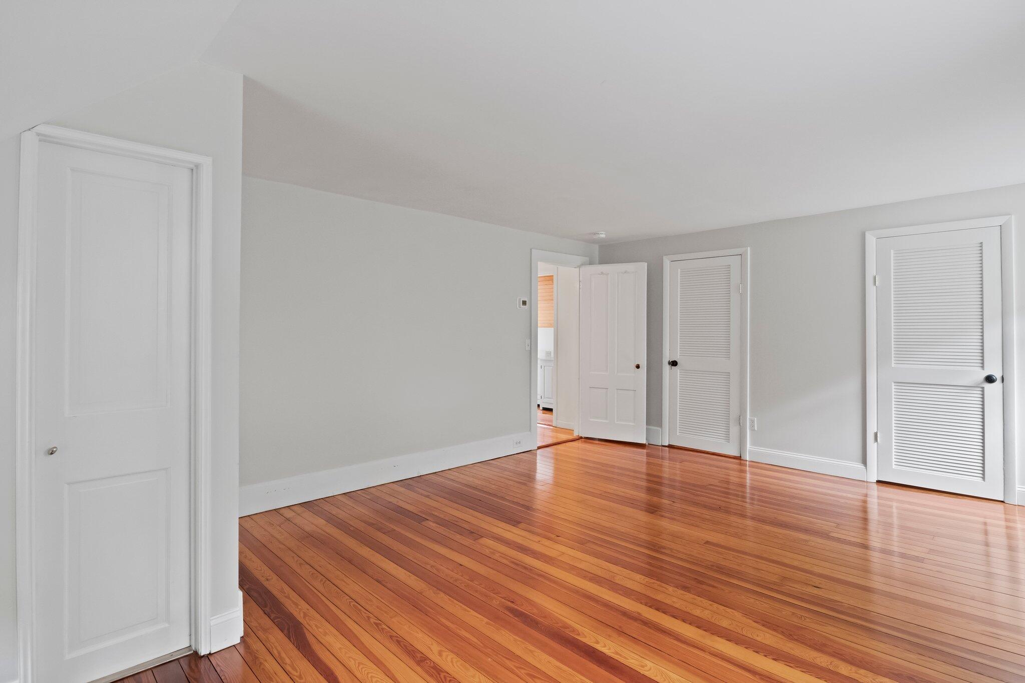 99 Main Street Sandwich, MA 02563 - Photo 26 of 43 a view of an empty room with wooden floor