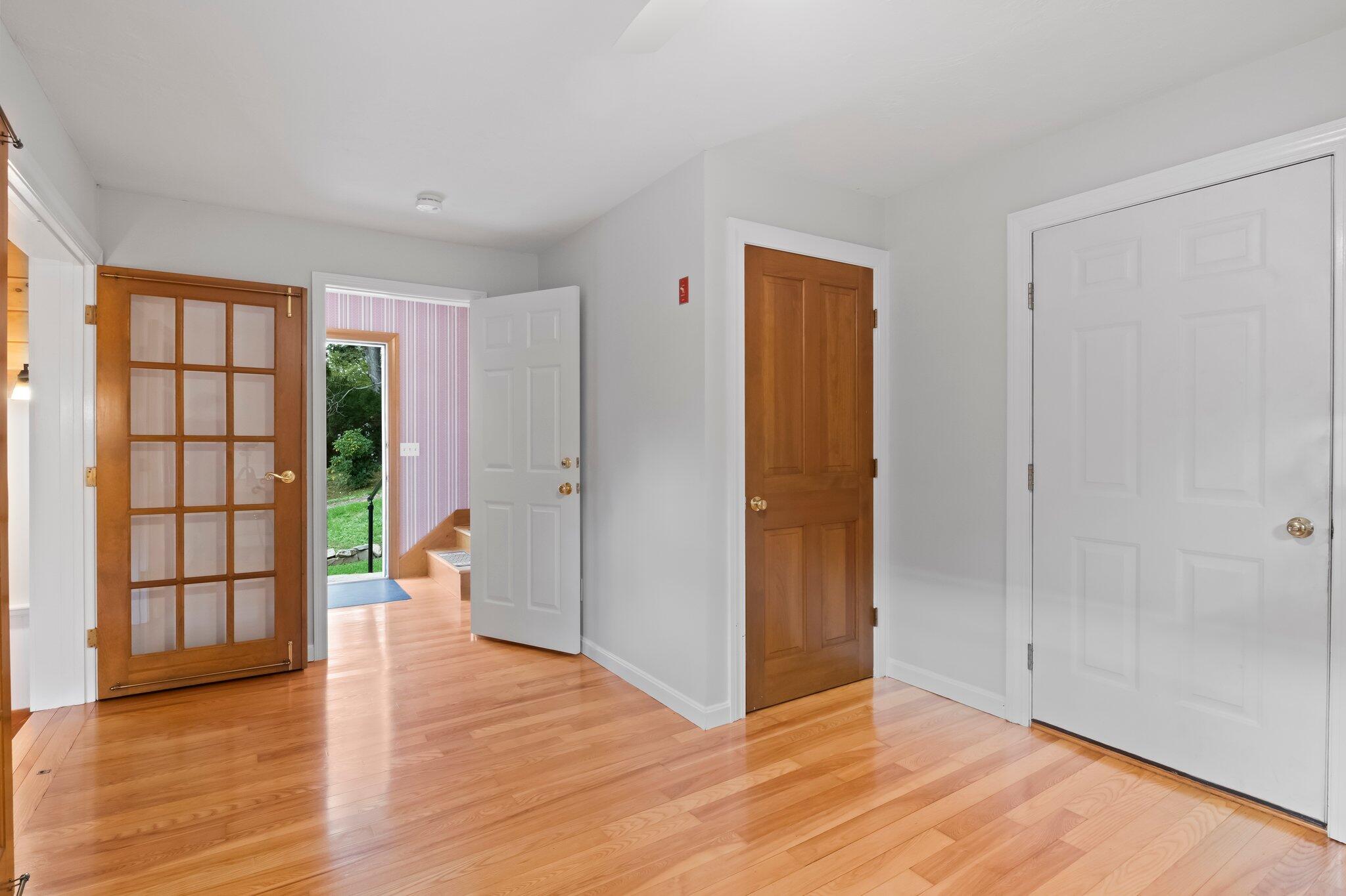 99 Main Street Sandwich, MA 02563 - Photo 29 of 43 a view of an empty room with wooden floor and a window