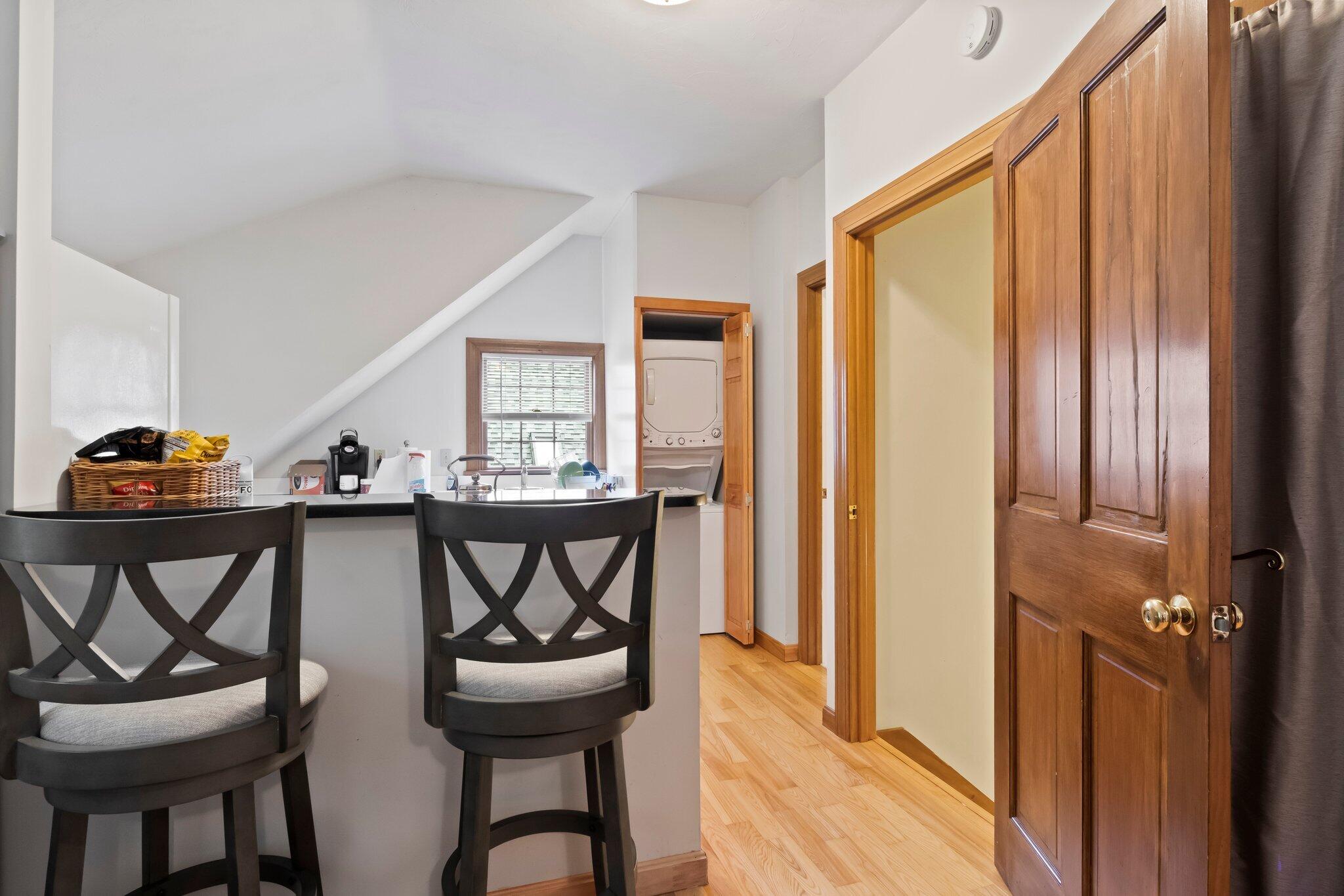 99 Main Street Sandwich, MA 02563 - Photo 31 of 43 a view of a dining room with furniture and a chandelier