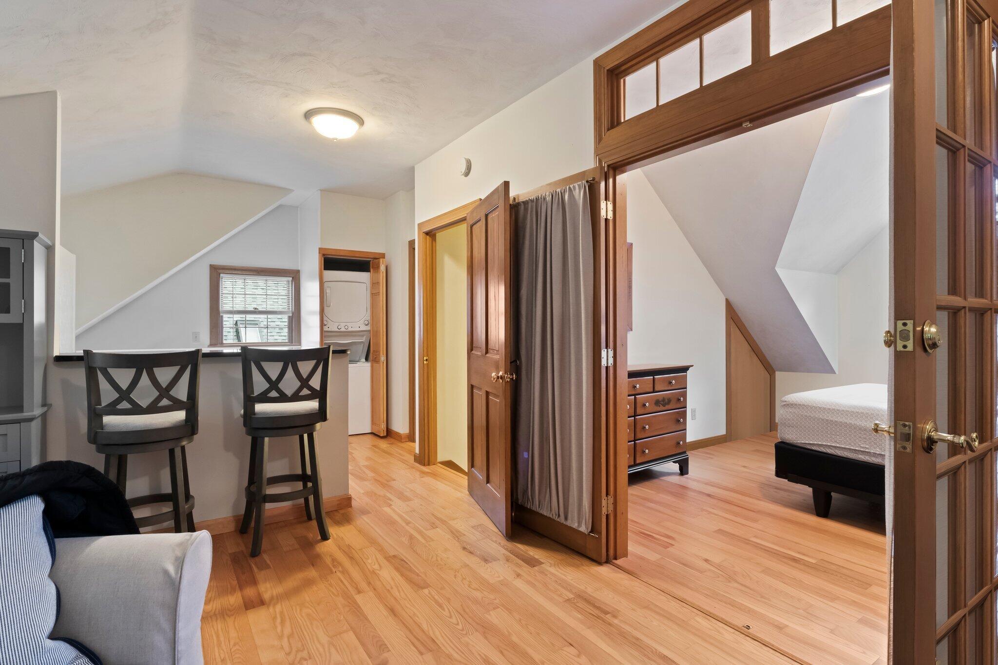 99 Main Street Sandwich, MA 02563 - Photo 32 of 43 a view of a hallway with furniture and wooden floor