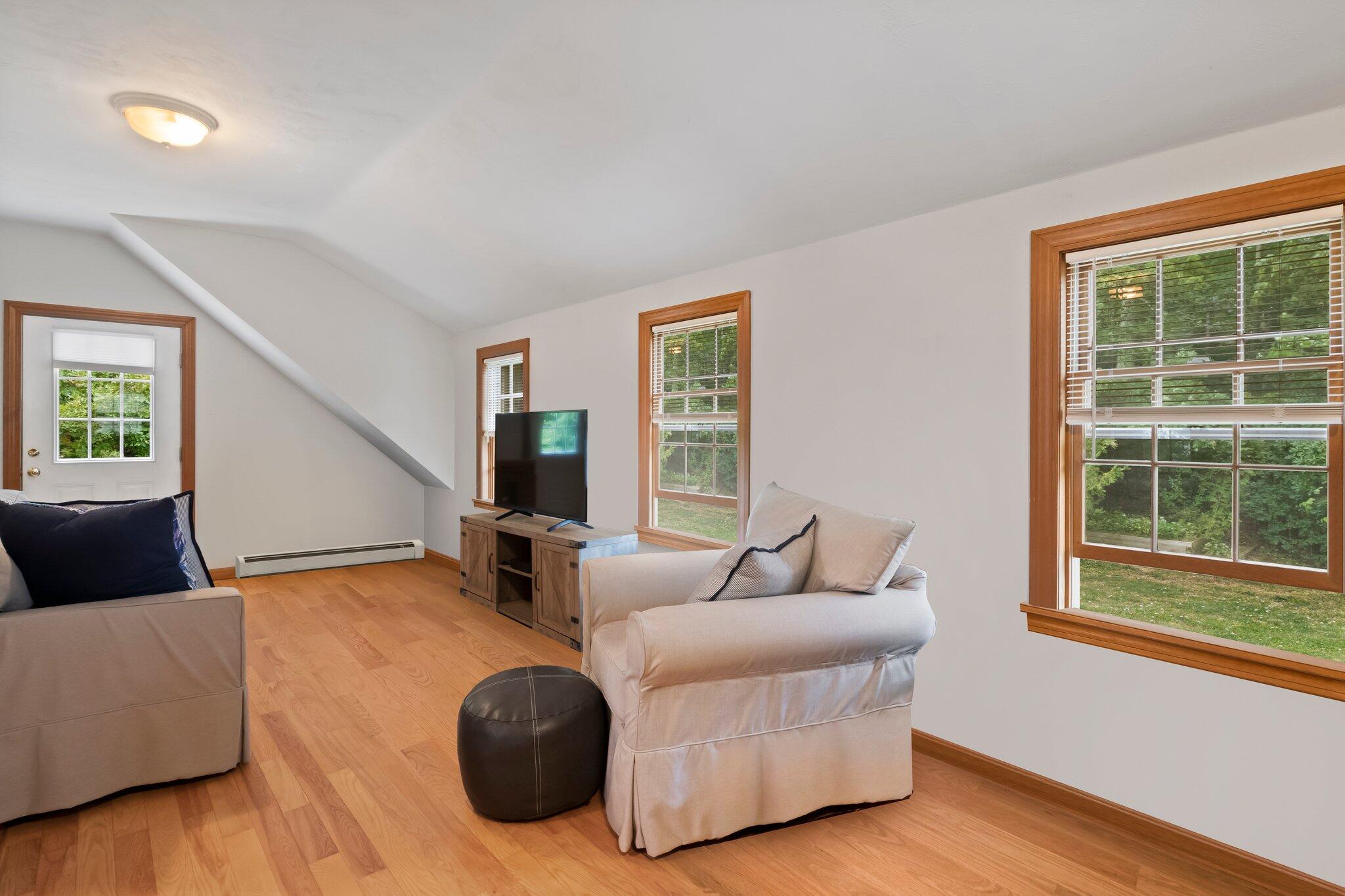 99 Main Street Sandwich, MA 02563 - Photo 33 of 43 a living room with furniture and a large window