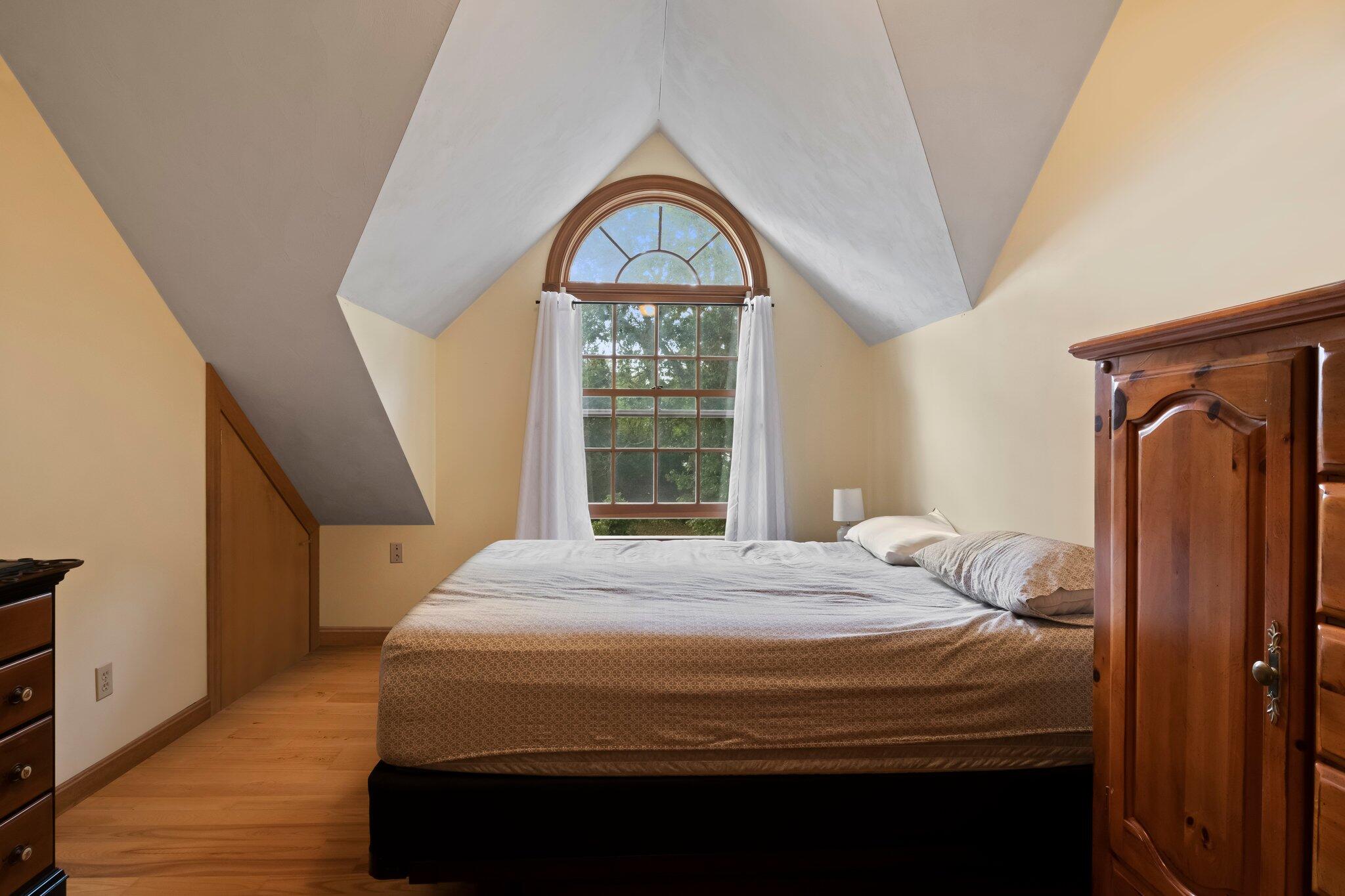 99 Main Street Sandwich, MA 02563 - Photo 34 of 43 a bedroom with a bed and a window