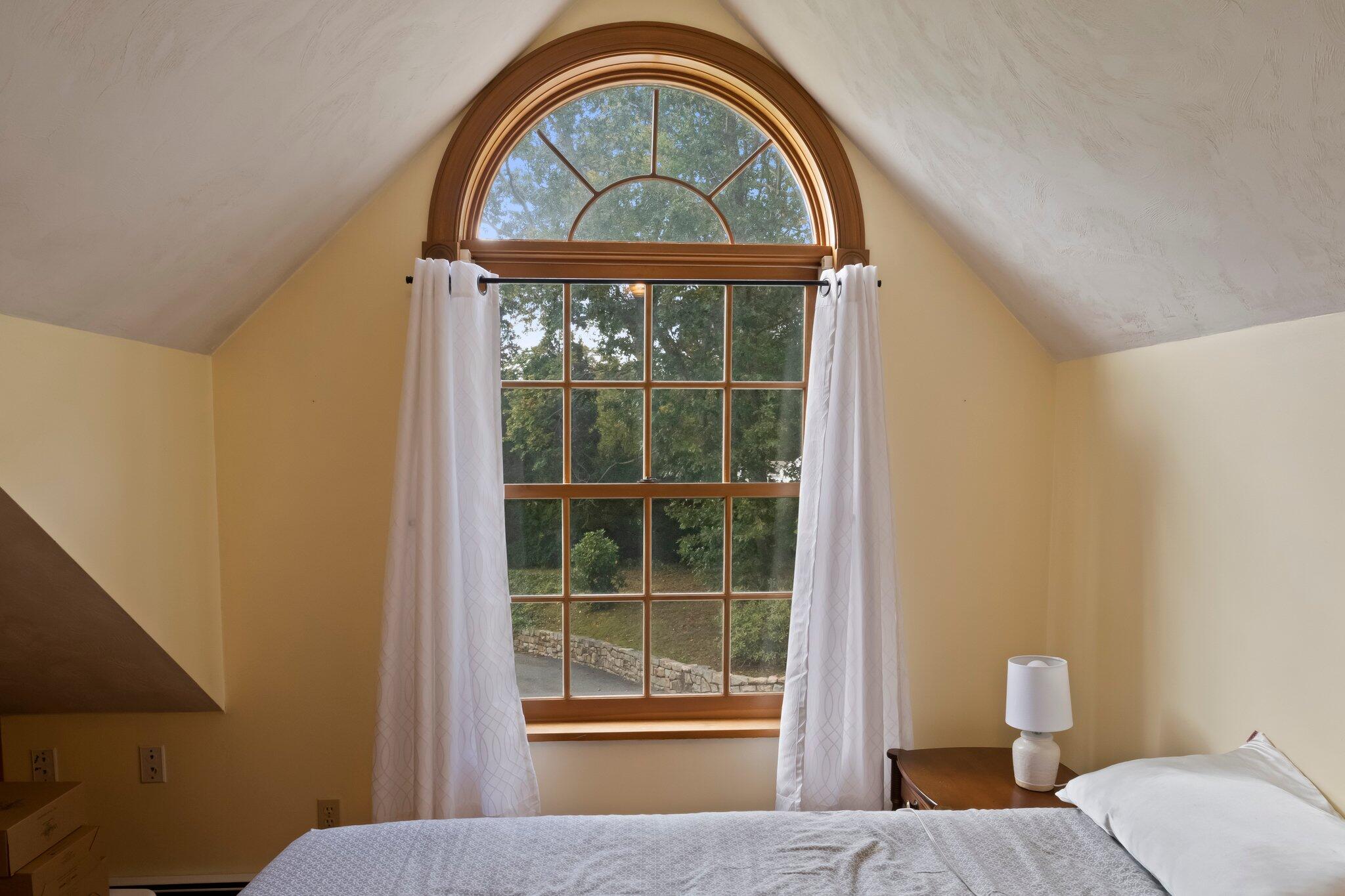 99 Main Street Sandwich, MA 02563 - Photo 35 of 43 a view of a bedroom with a bed and a window