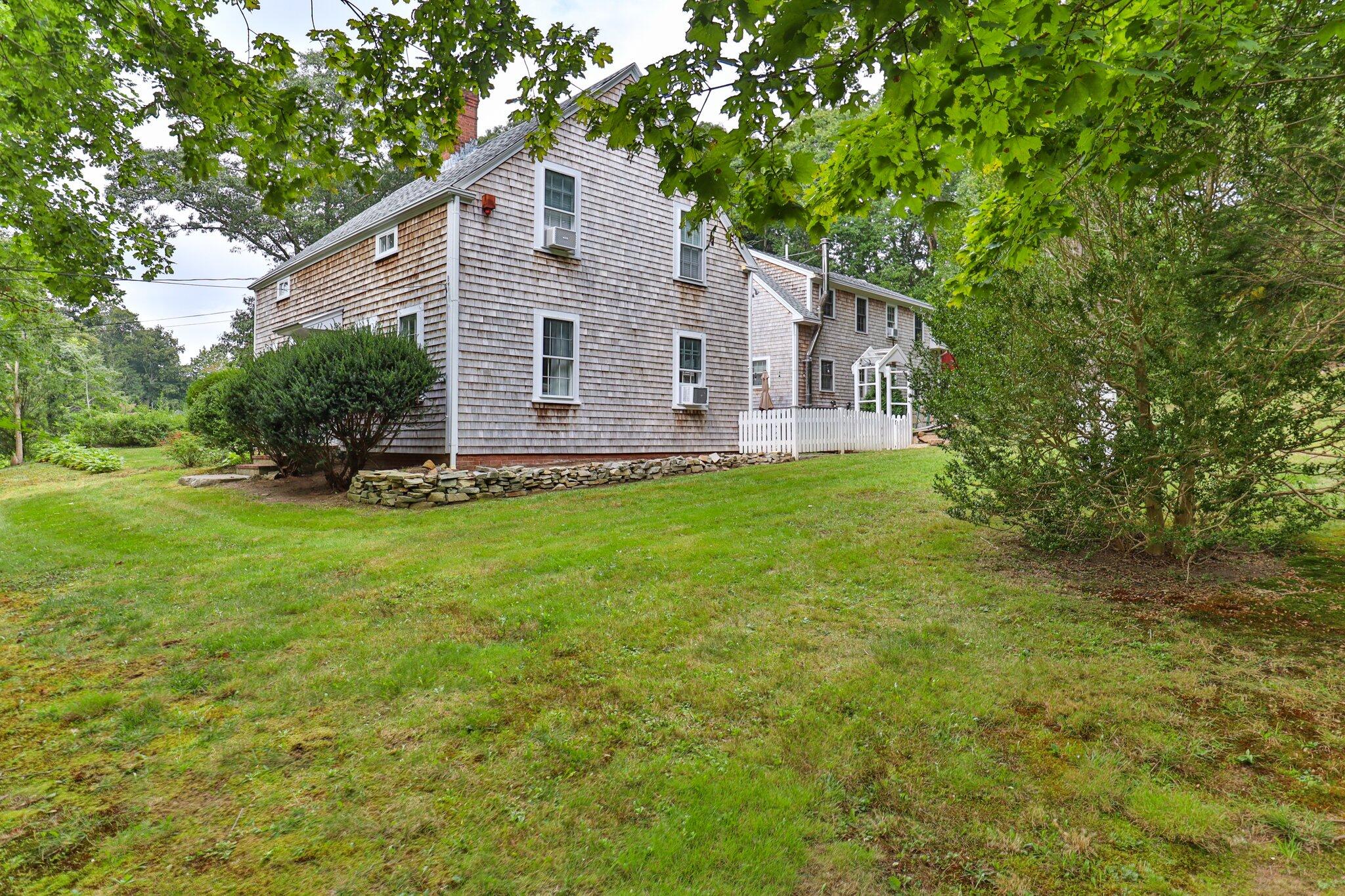 99 Main Street Sandwich, MA 02563 - Photo 5 of 43 a view of a house with a yard