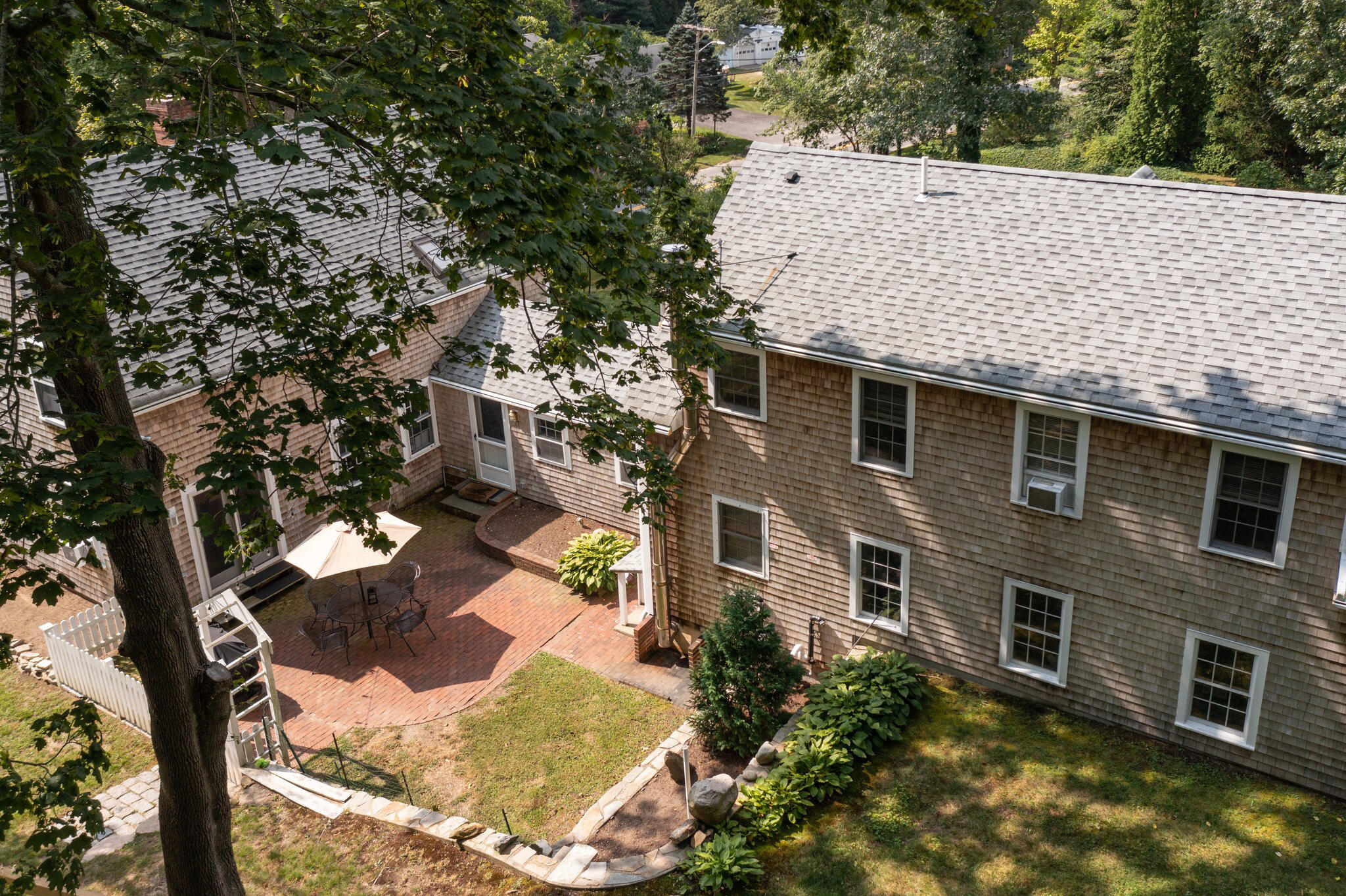 99 Main Street Sandwich, MA 02563 - Photo 8 of 43 a view of a house with a yard