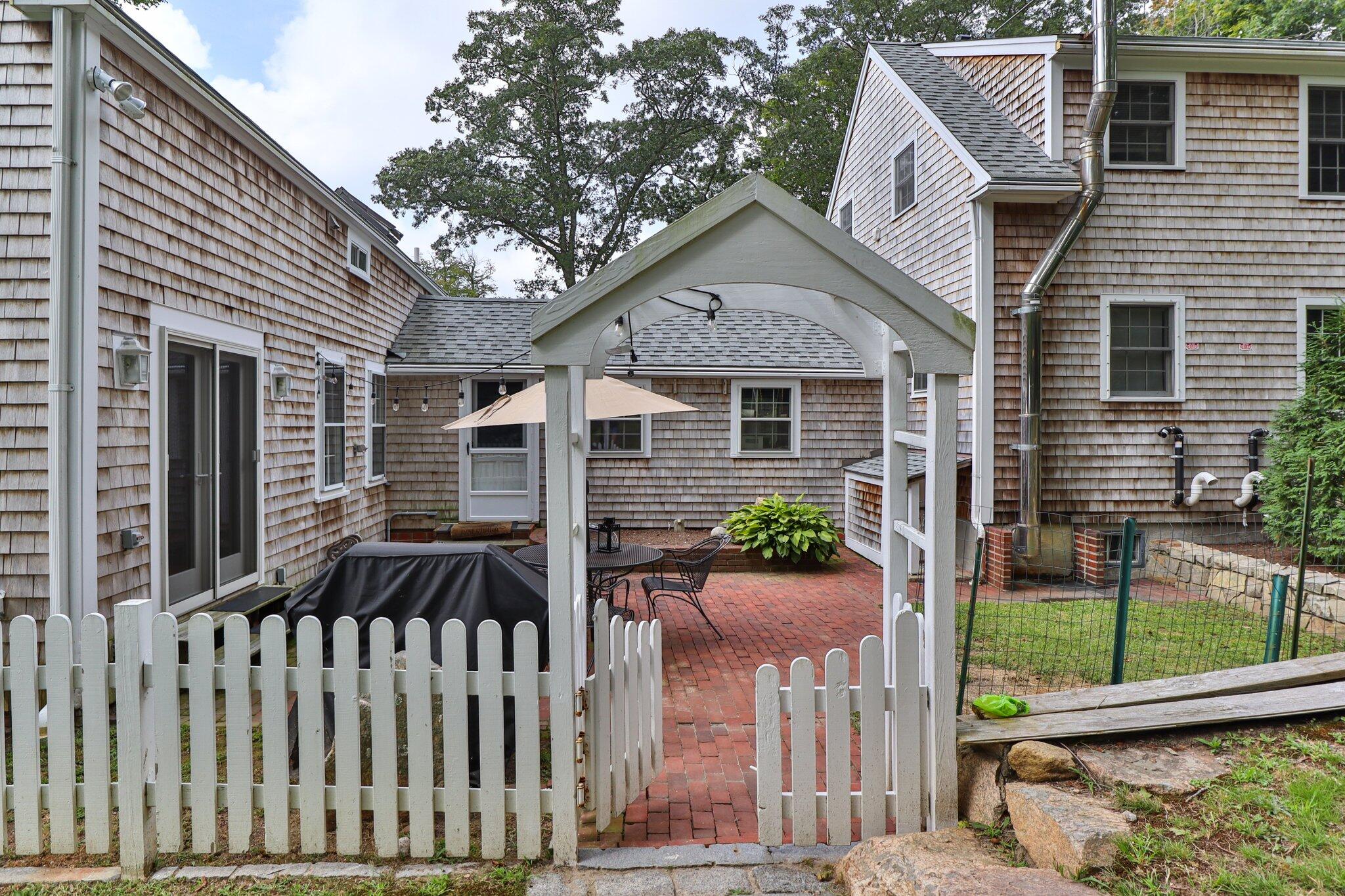99 Main Street Sandwich, MA 02563 - Photo 9 of 43 a front view of house with a garden