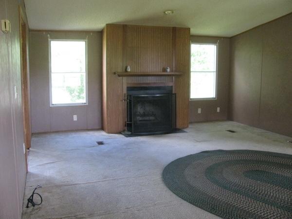 812 Hale Road Northeast Pilot, VA 24138 - Photo 15 of 16 a room with a fireplace and window