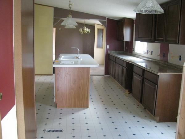 812 Hale Road Northeast Pilot, VA 24138 - Photo 6 of 16 a kitchen with kitchen island granite countertop a sink and cabinets