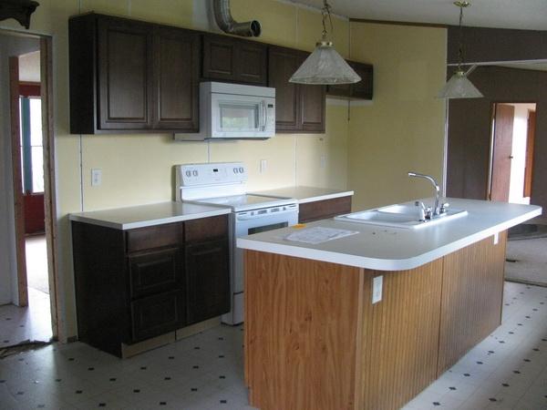 812 Hale Road Northeast Pilot, VA 24138 - Photo 7 of 16 a kitchen with a sink cabinets and appliances