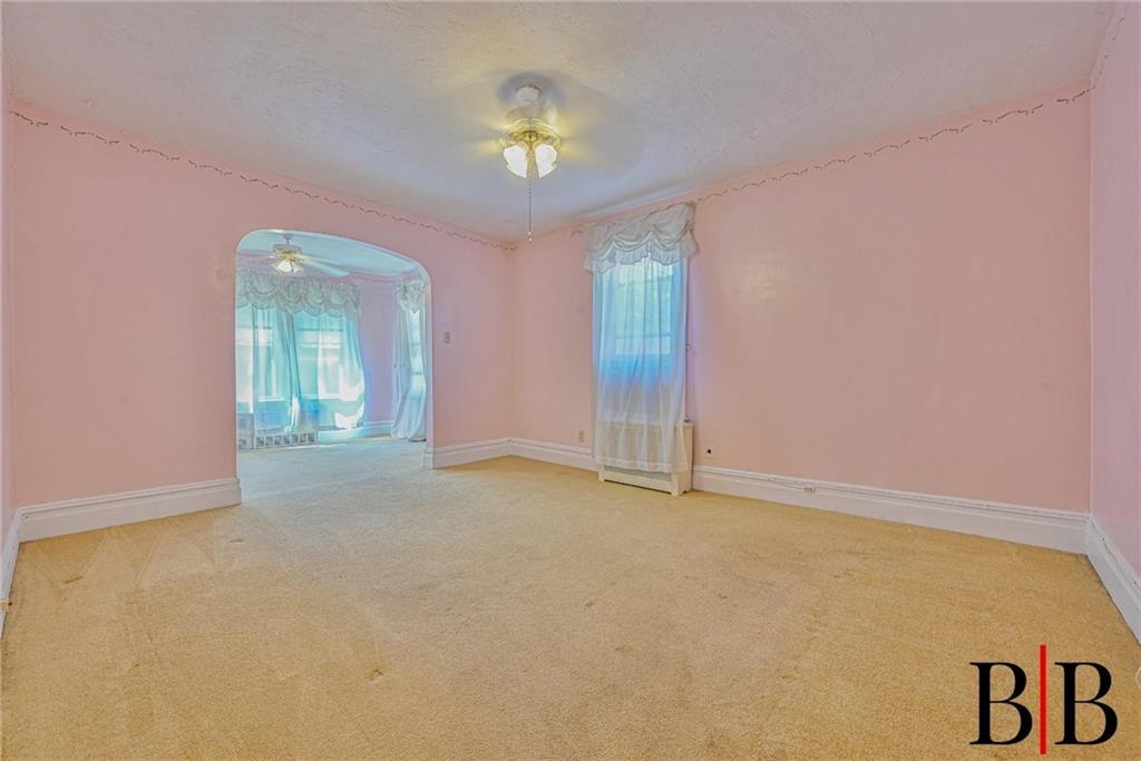 2219 83rd Street Brooklyn, NY 11214 - Photo 16 of 25 a view of an empty room with a window