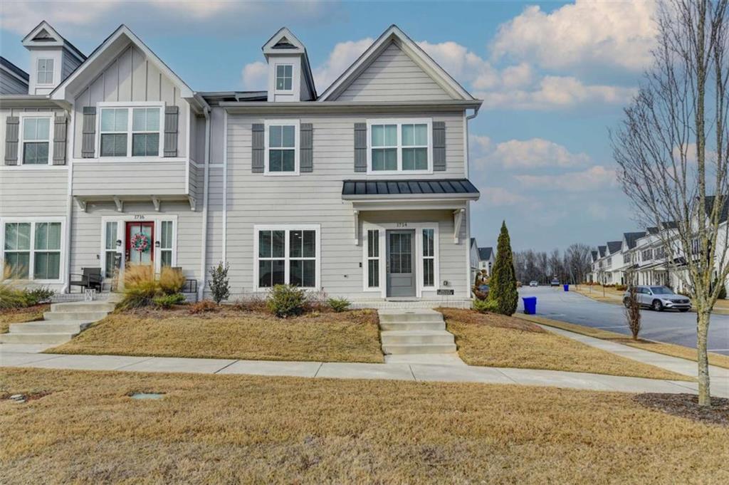 a front view of a house with a yard
