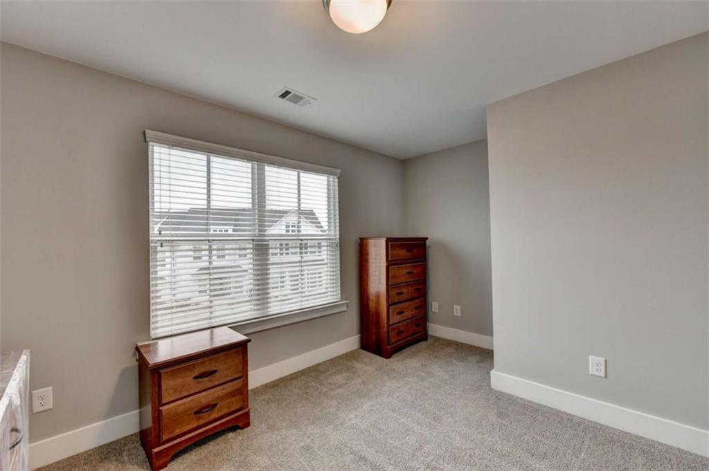 1714 Prospect Way Conyers, GA 30094 - Photo 19 of 35 an empty room with furniture and a window