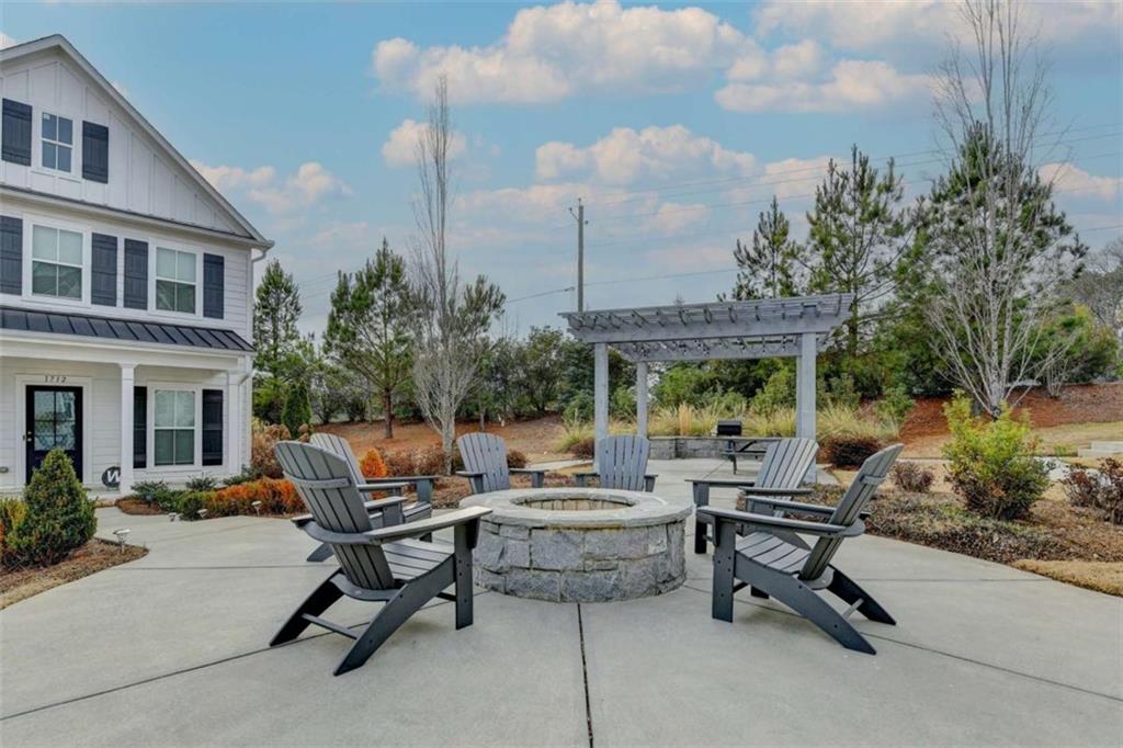 1714 Prospect Way Conyers, GA 30094 - Photo 2 of 35 a view of a patio with a table and chairs
