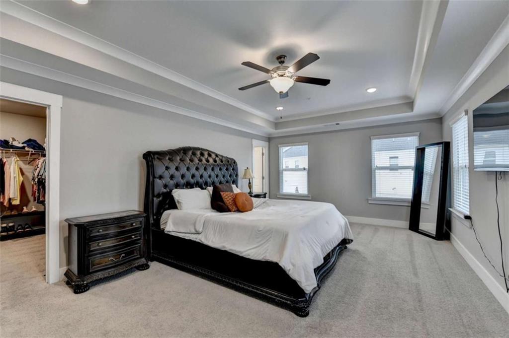 1714 Prospect Way Conyers, GA 30094 - Photo 24 of 35 a bedroom with a bed and a ceiling fan