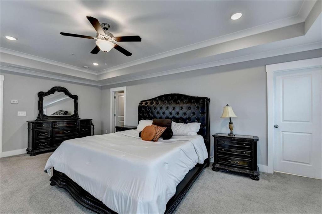 1714 Prospect Way Conyers, GA 30094 - Photo 26 of 35 a bedroom with bed and a chandelier