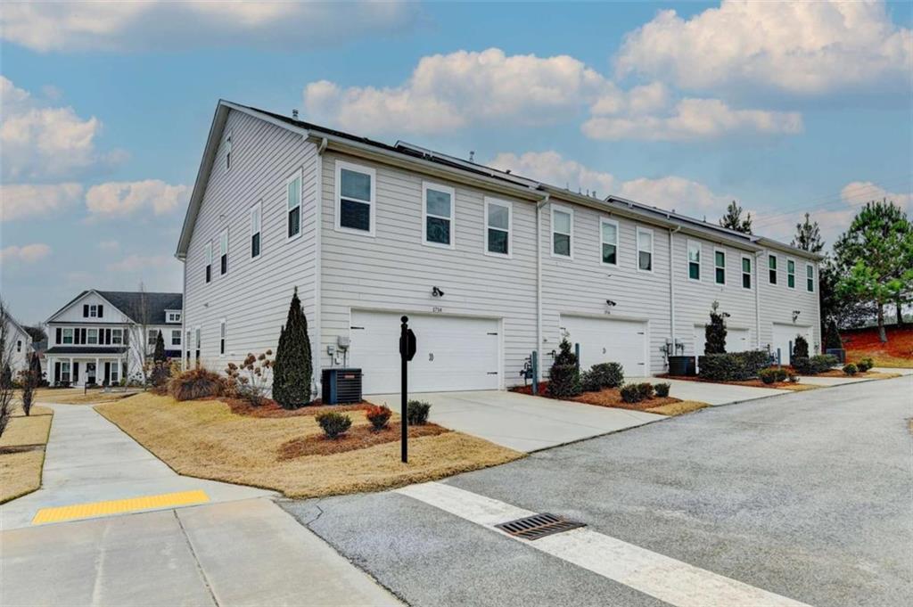 1714 Prospect Way Conyers, GA 30094 - Photo 34 of 35 a front view of a building with cars parked