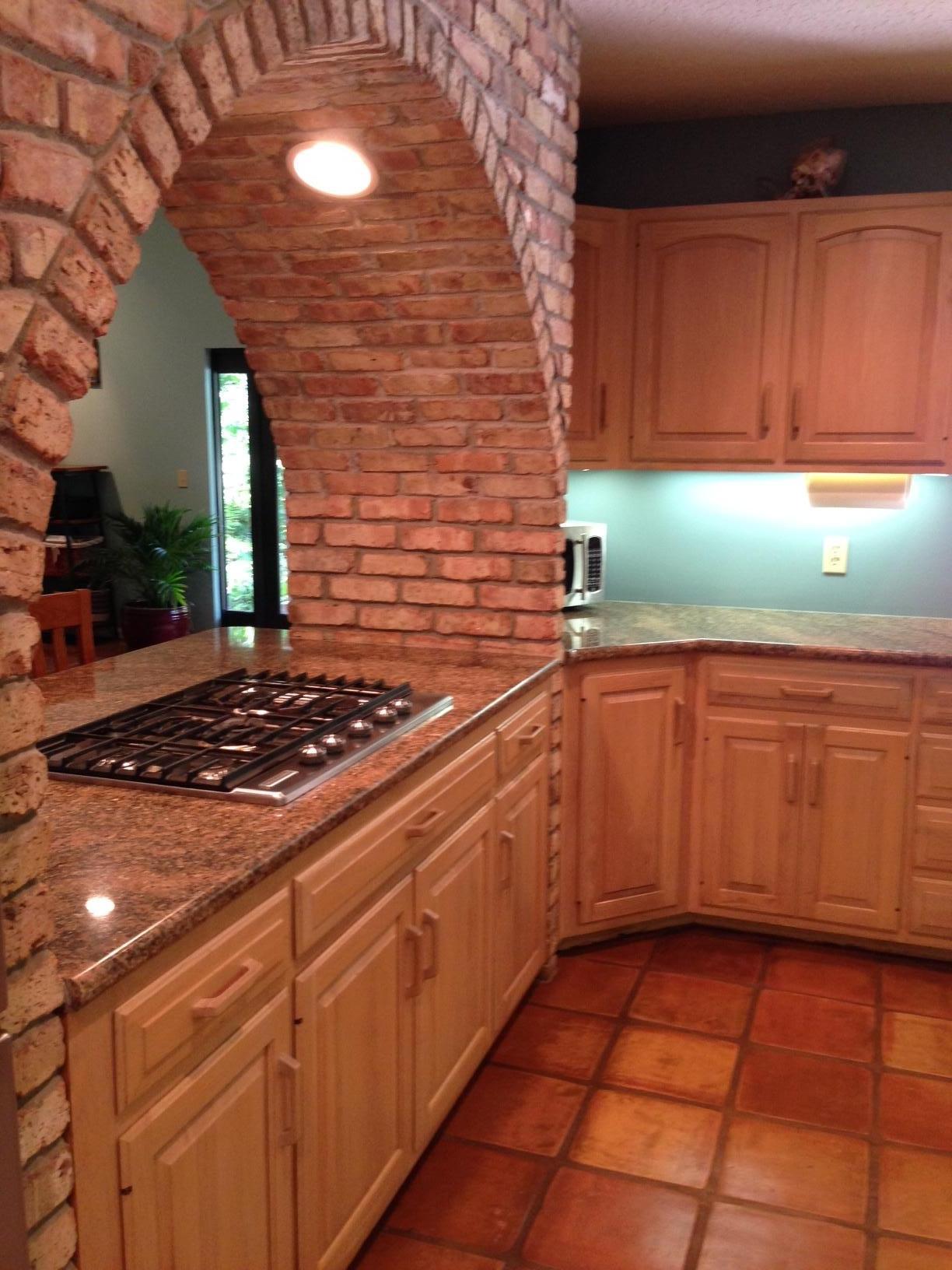 5378 Pennock Point Road Jupiter, FL 33458 - Photo 15 of 59 Gas stove surrounded by Chicago Brick