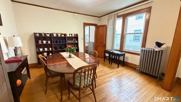 a view of a room with furniture and window