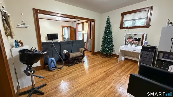 a view of a room with wooden floor