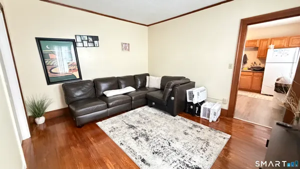 a room with furniture and a floor to ceiling window